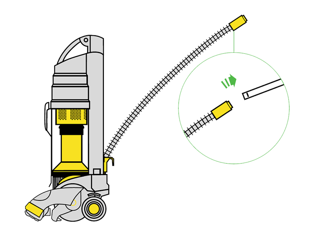 Extracción de la empuñadura de la manguera en la aspiradora vertical Dyson DC01.
